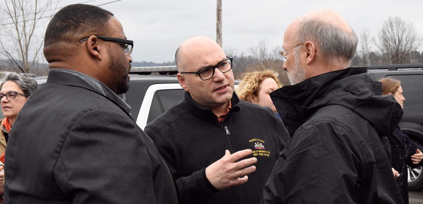 Representative Matzie speaking with Governor Wolf and group of people in parking lot