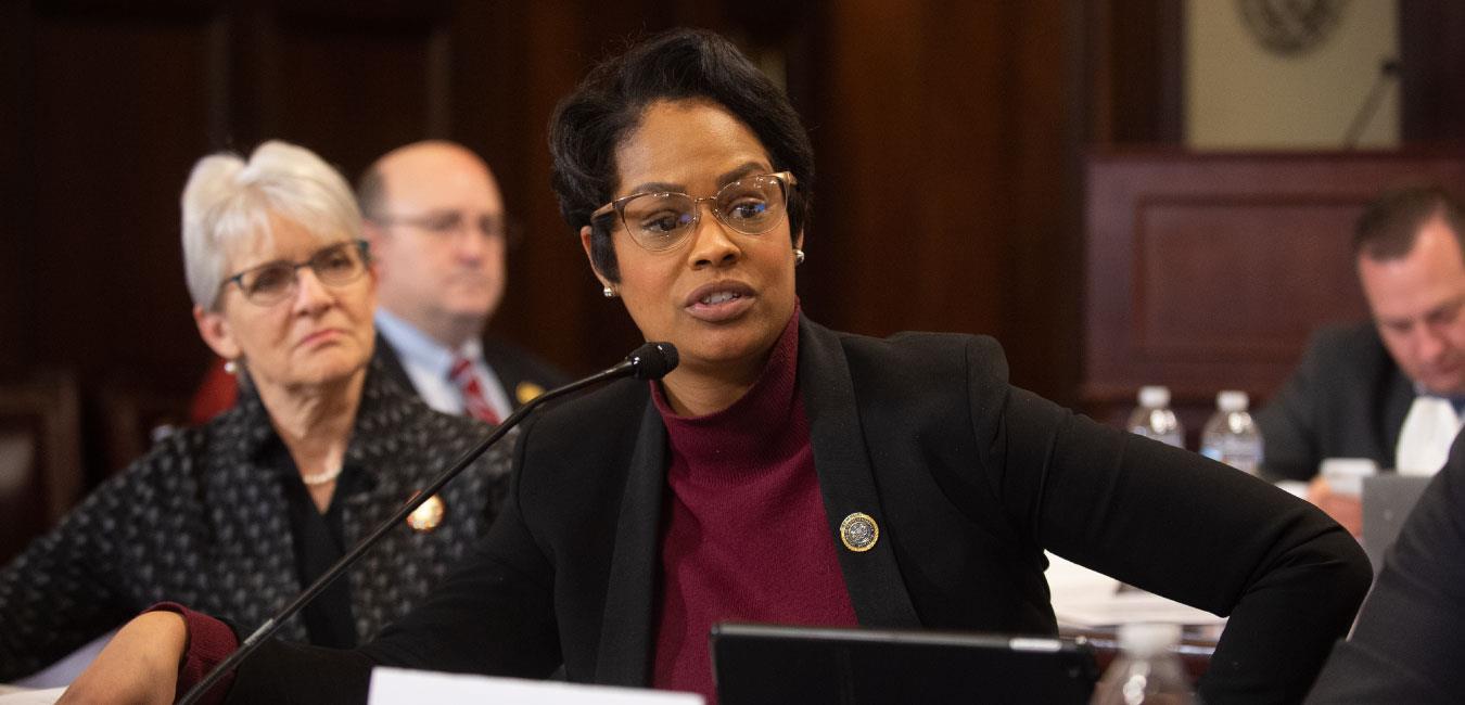 Representative Cephas speaking into microphone at hearing