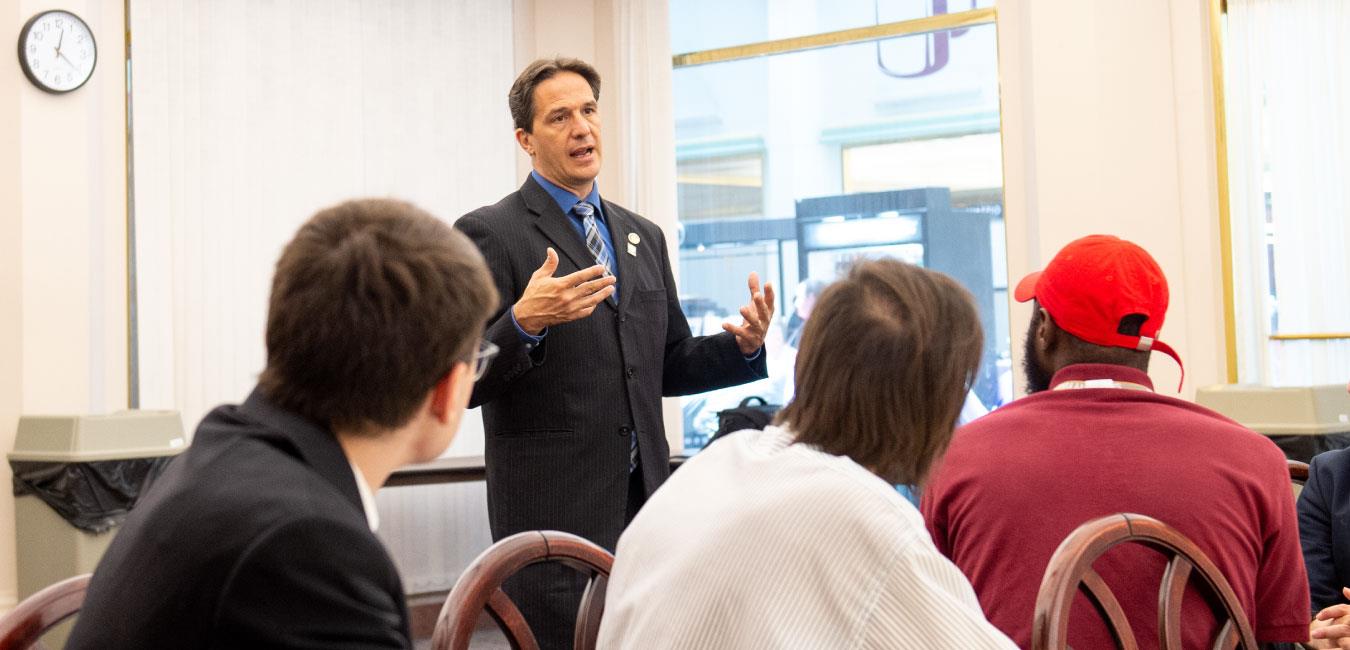 Representative Hohenstein speaking to group of people